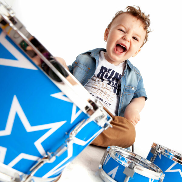 smiling kid with drums