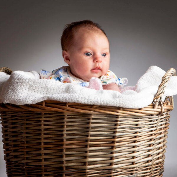 photo of a baby in a basket