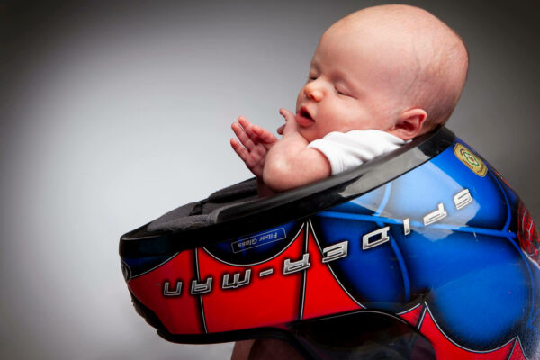 photo of baby in a spinderman seat