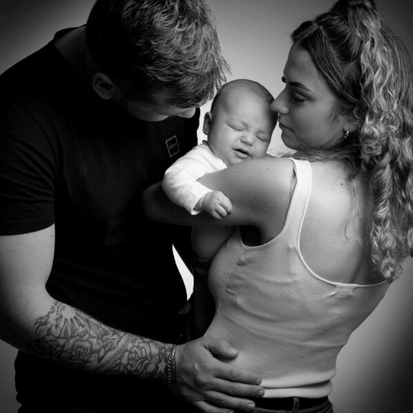 black and white new born baby with parents photo