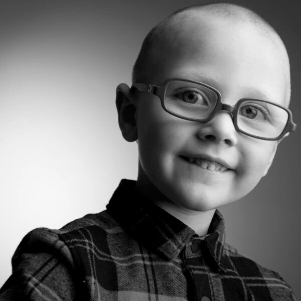 smiling boy with glasses